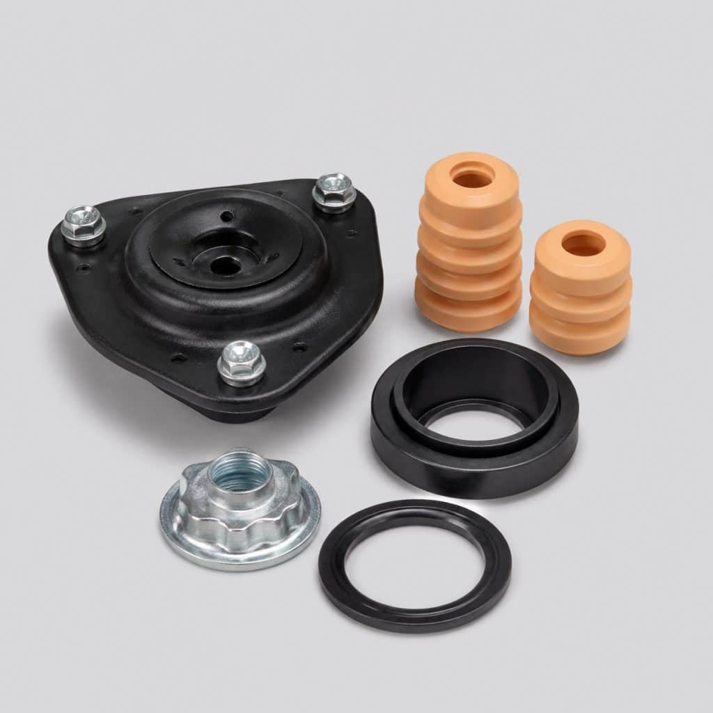 Kit de montage pour amortisseur avec écrou et cache-poussière sur fond clair