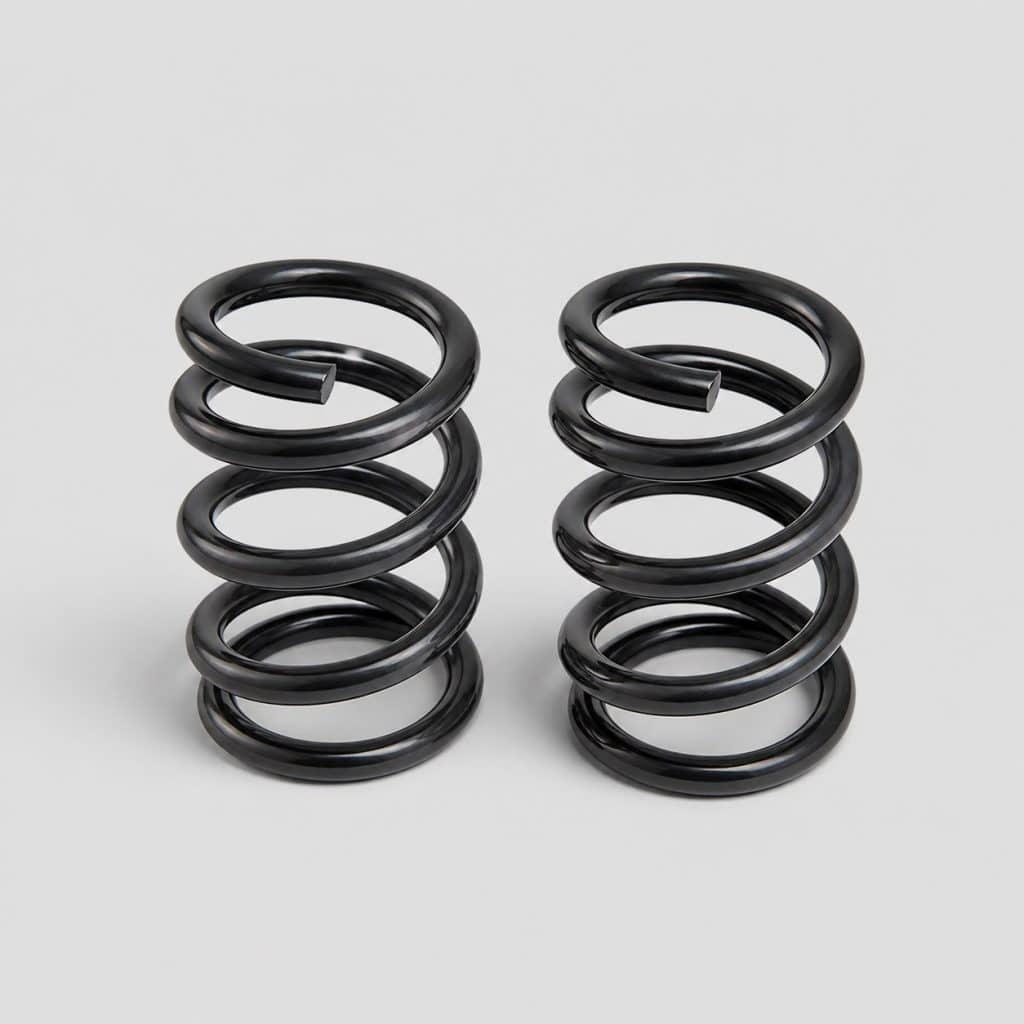 Jeu de deux ressorts courts pour Volkswagen Golf 5 sur fond clair